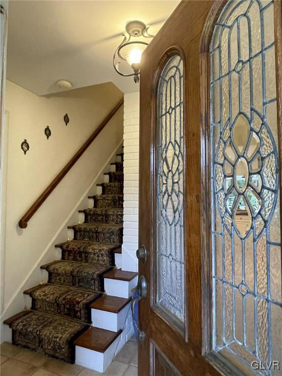 1145 Church Road Wind Gap, PA 18091 - Photo 8 of 24 a view of staircase with lots of frames on wall and a window