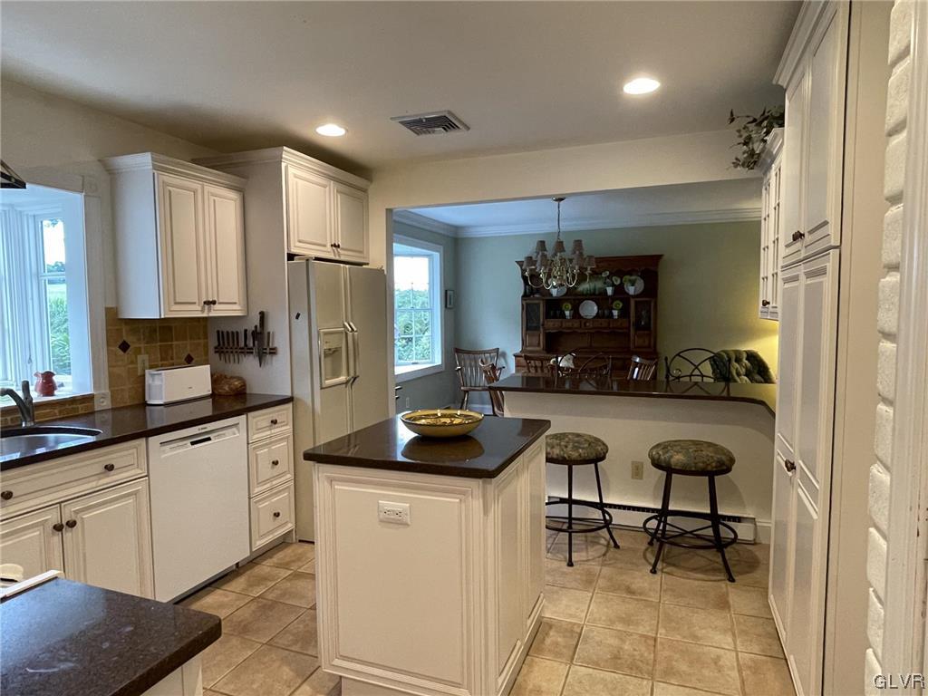 1145 Church Road Wind Gap, PA 18091 - Photo 9 of 24 a kitchen with stainless steel appliances kitchen island granite countertop a sink and cabinets