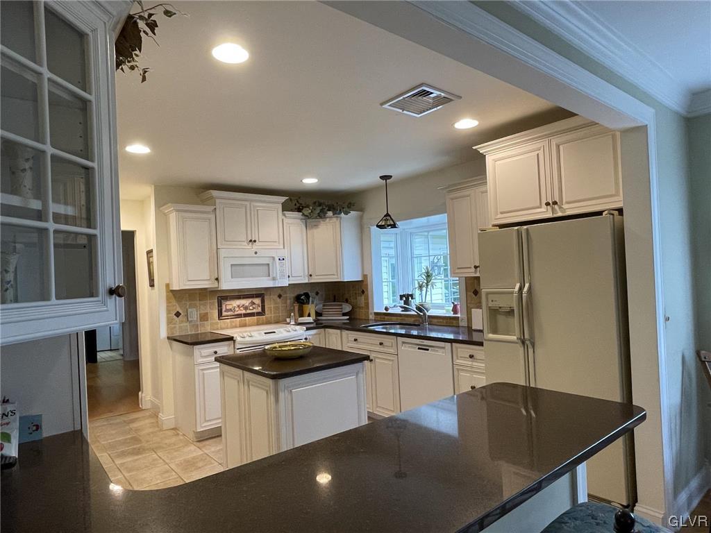 1145 Church Road Wind Gap, PA 18091 - Photo 10 of 24 a kitchen with kitchen island a sink stove and refrigerator