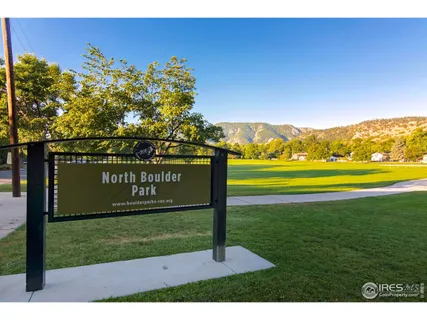 a view of a park with an sign board