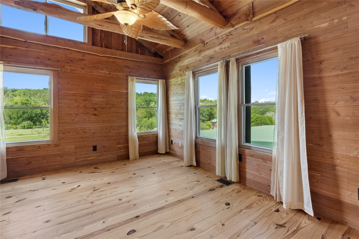 4032 Ranch Road 3232 Johnson City, TX 78636 - Photo 13 of 40 This guest bedroom also boasts high ceilings with log accents and outstanding views