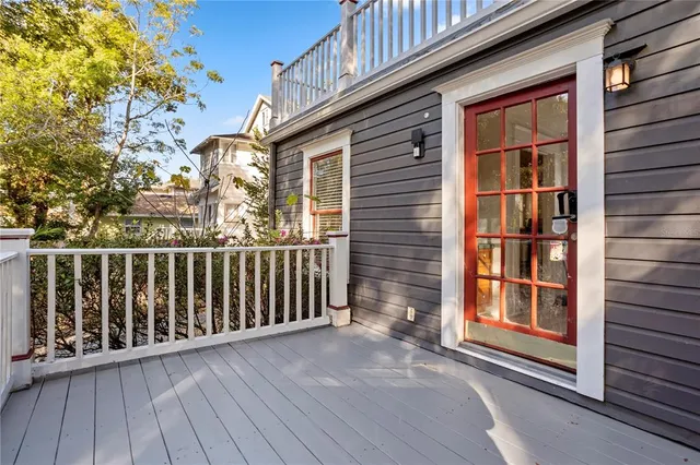a view of a brick house with large windows