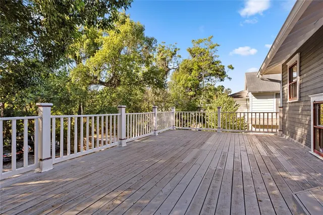a view of deck with wooden floor and fence