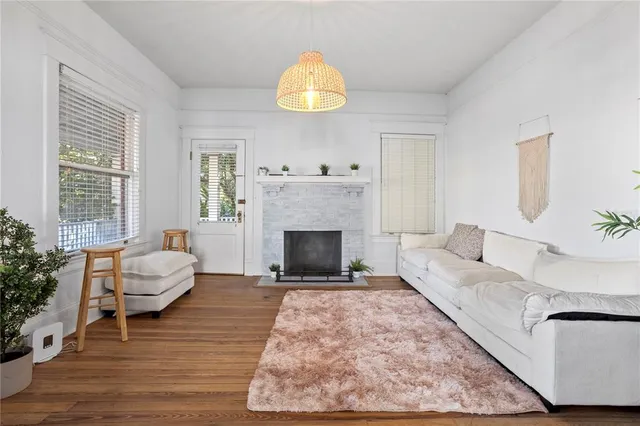 a living room with furniture and a fireplace