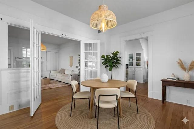 a view of a dining room with furniture and wooden floor