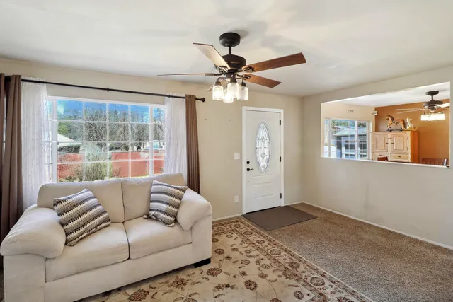 a living room with furniture and a window