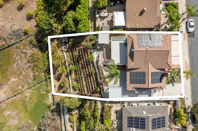 aerial view of a house with a garden