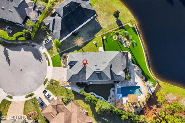 an aerial view of a house with a garden
