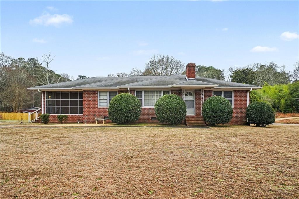 4568 Austell Powder Springs Road Southwest Austell, GA 30106 - Photo 2 of 15 front view of a house with a patio