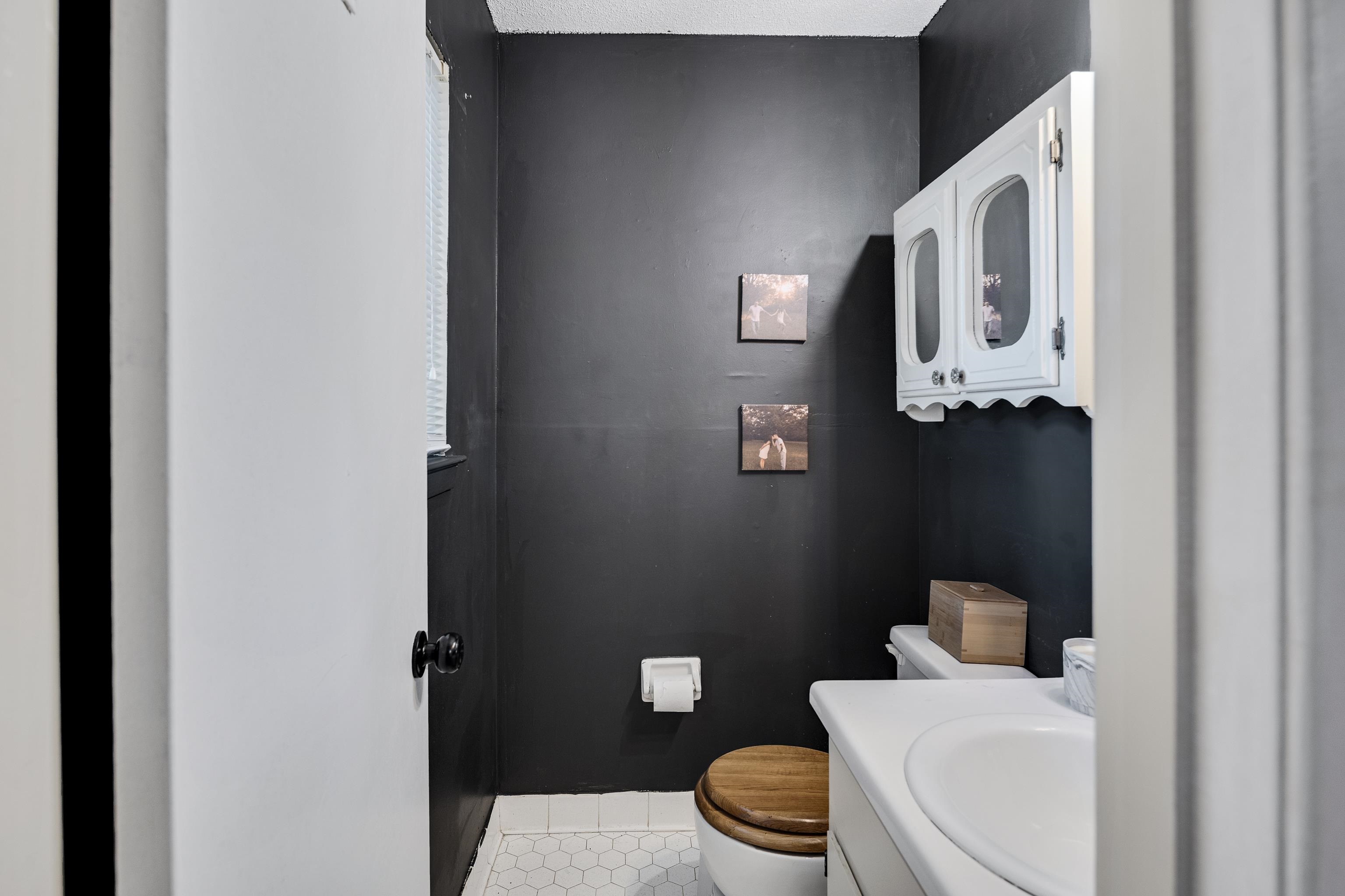 1137 Greenview Road Collierville, TN 38017 - Photo 26 of 35 a white toilet sitting next to a bathroom sink