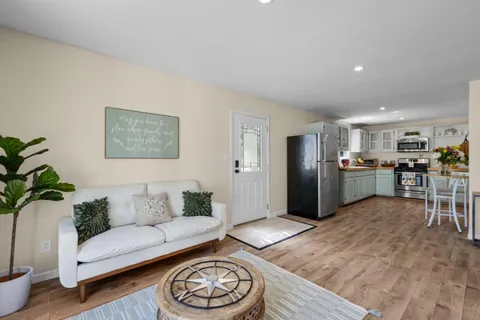 a bedroom with a bed and a potted plant