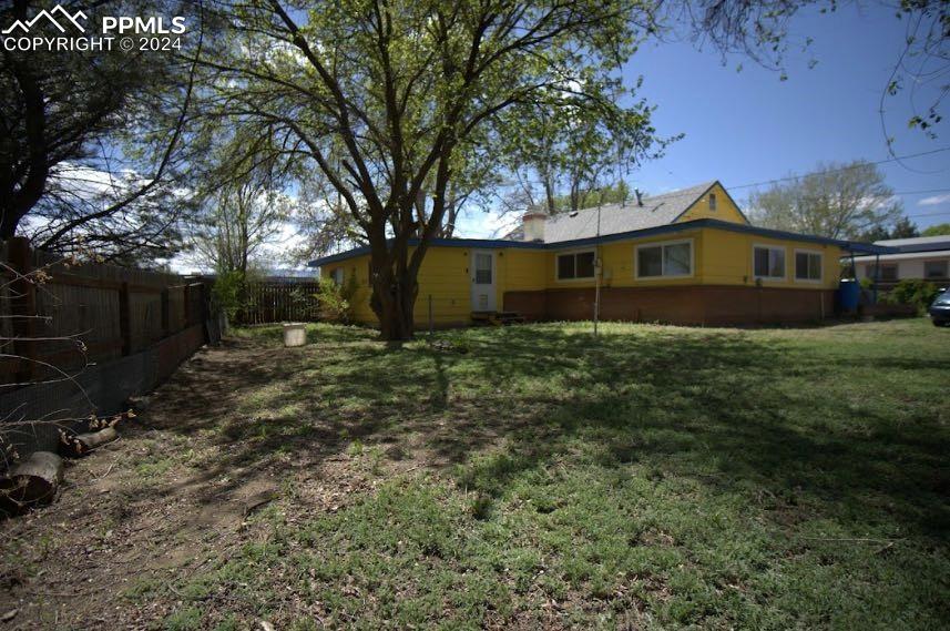 1015 Main Street Florence, CO 81226 - Photo 1 of 8 a front view of house with yard and trees
