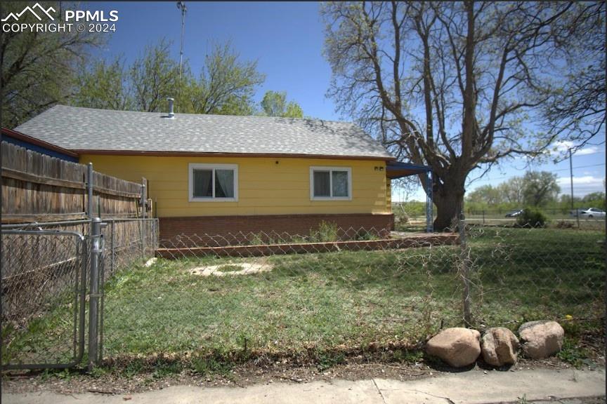 1015 Main Street Florence, CO 81226 - Photo 6 of 8 a backyard of a house with lots of green space