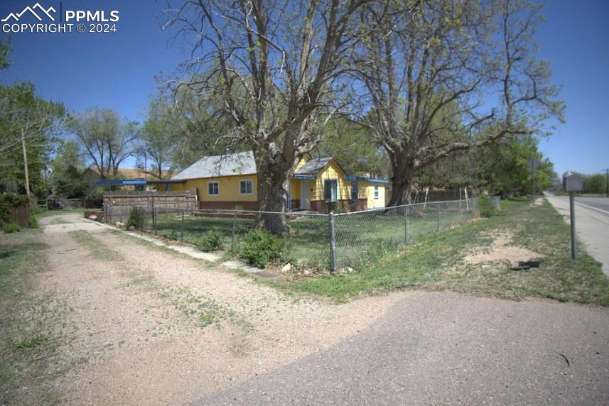 1015 Main Street Florence, CO 81226 - Photo 7 of 8 a view of a house with a yard