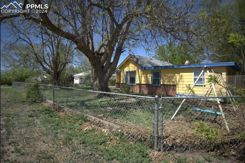 1015 Main Street Florence, CO 81226 - Photo 8 of 8 a backyard of a house with lots of green space