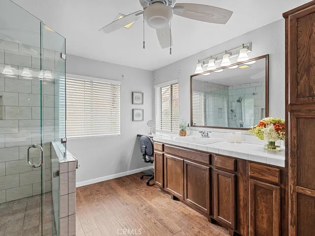 a bathroom with a double vanity sink and a mirror