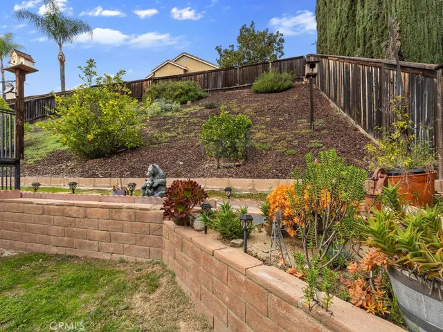 a view of swimming pool with chairs and umbrella