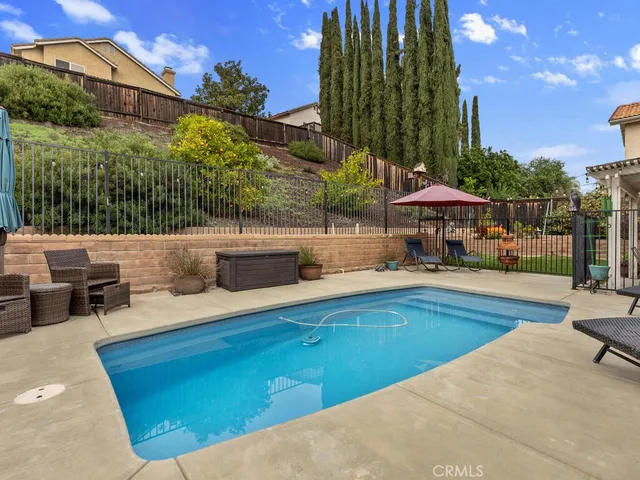 a view of a swimming pool with a patio