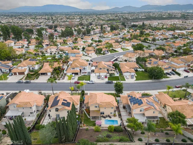 a view of a patio with table and chairs and potted plants