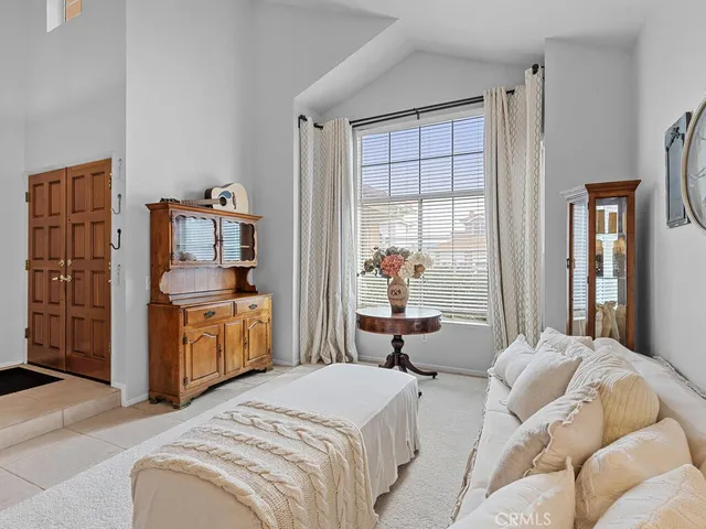 a bedroom with bed and window