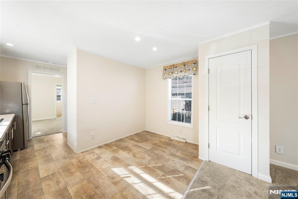 225 Albert Street Lodi, NJ 07644 - Photo 11 of 24 a view of an empty room with a cabinet