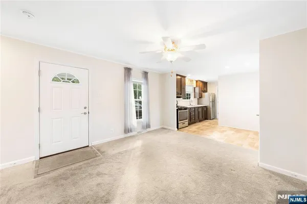 a view of a kitchen with furniture and a kitchen