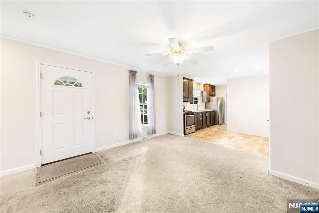 225 Albert Street Lodi, NJ 07644 - Photo 15 of 24 a view of a kitchen with furniture and a kitchen
