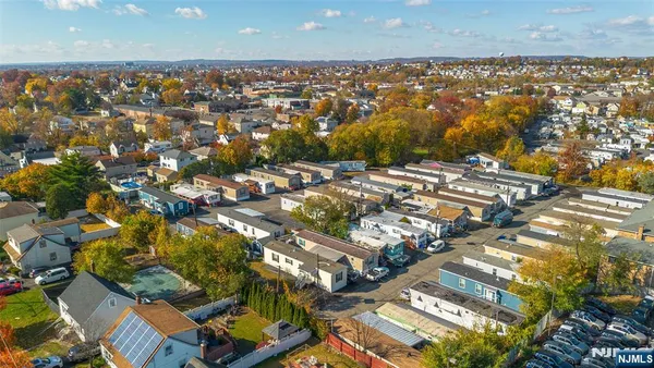 an aerial view of residential building and parking space