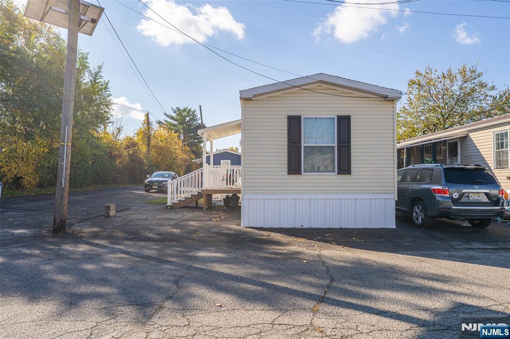 225 Albert Street Lodi, NJ 07644 - Photo 3 of 24 a view of a car park in front of house