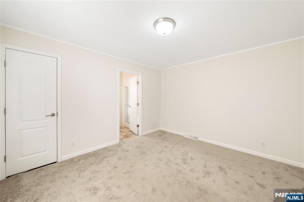 225 Albert Street Lodi, NJ 07644 - Photo 6 of 24 an empty room with an entryway