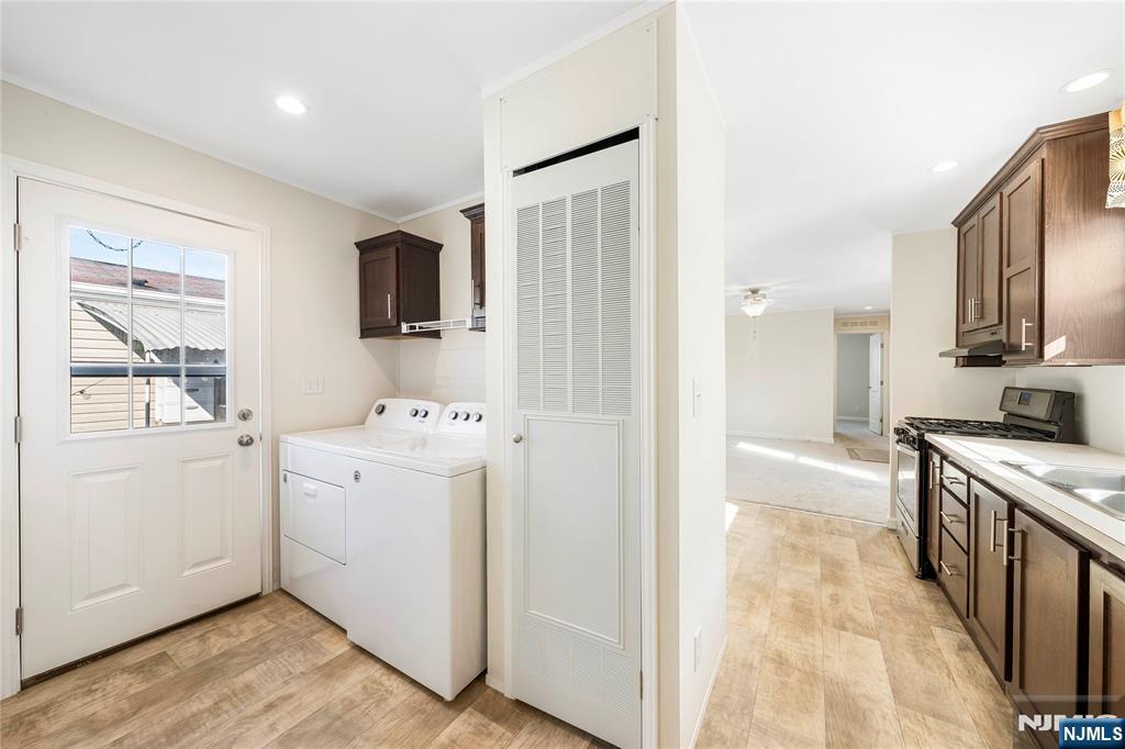 225 Albert Street Lodi, NJ 07644 - Photo 9 of 24 a kitchen with a stove a sink and a refrigerator