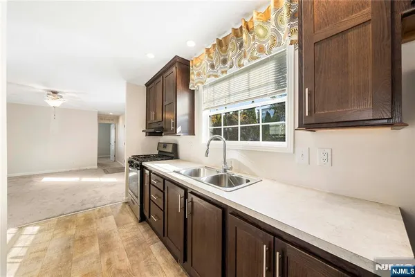 a kitchen with a sink and a stove