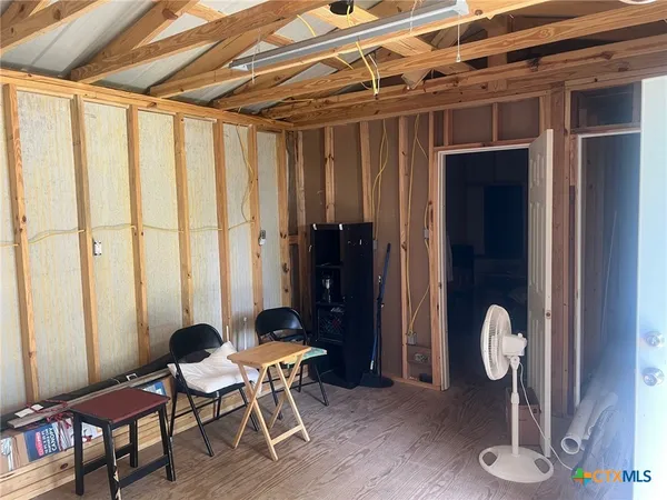 a view of a room with table and chair