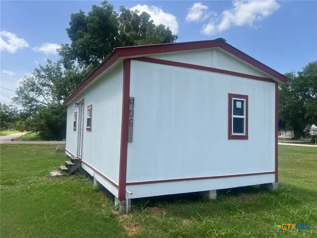 a view of backyard with trampoline