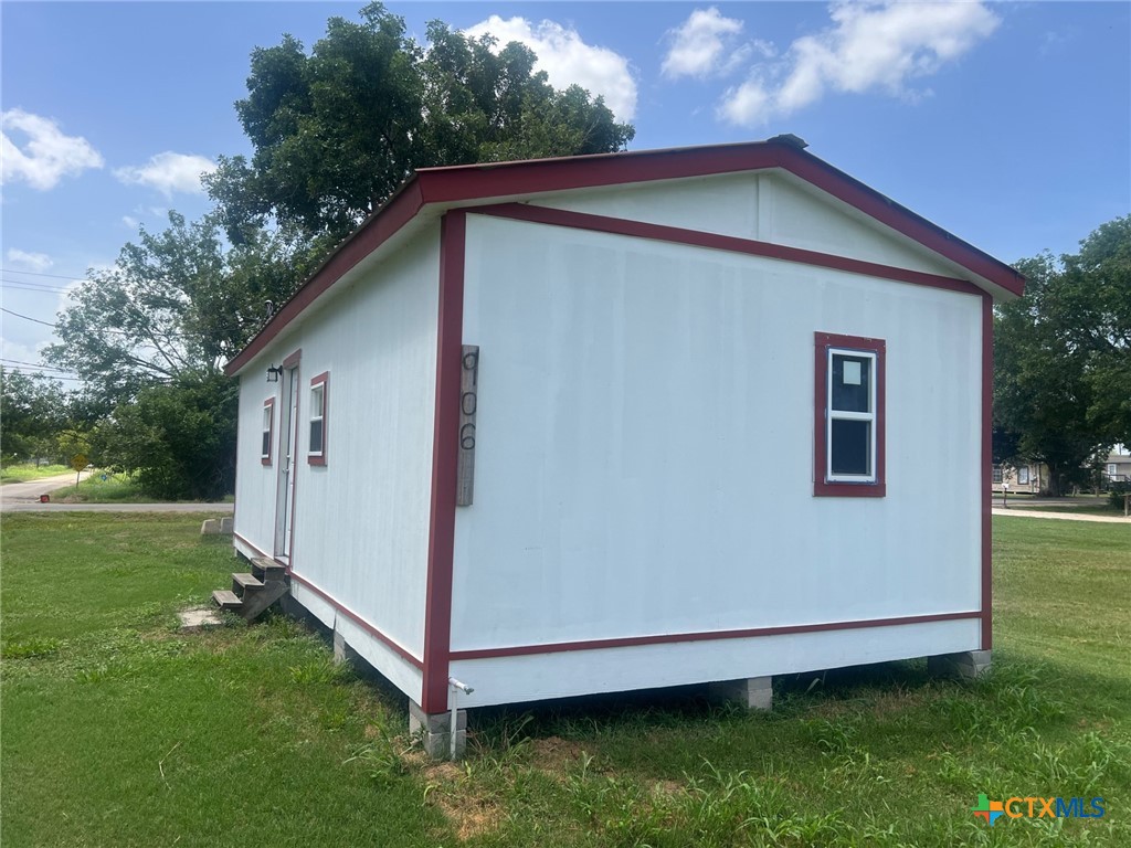906 4th Street Edna, TX 77957 - Photo 3 of 12 a view of backyard with trampoline