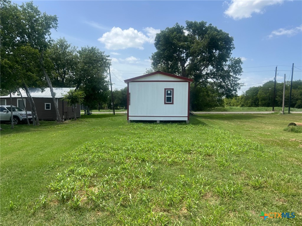 906 4th Street Edna, TX 77957 - Photo 5 of 12 a view of a house with a yard