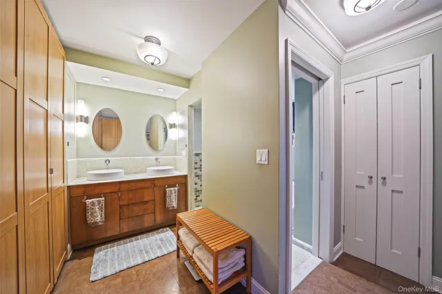 a room with a bed and a mirror