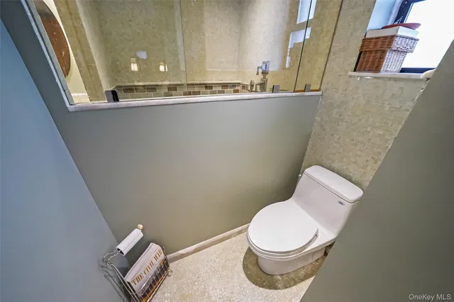 a bathroom with a toilet and a sink
