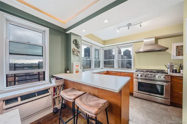 a dining room with a stove top oven and sink