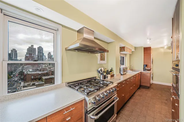 a living room with hard wood floor and a fireplace
