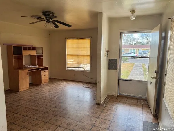 a view of an empty room with a window