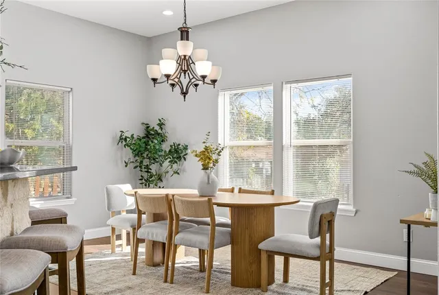 a view of a dining room with furniture window and outside view