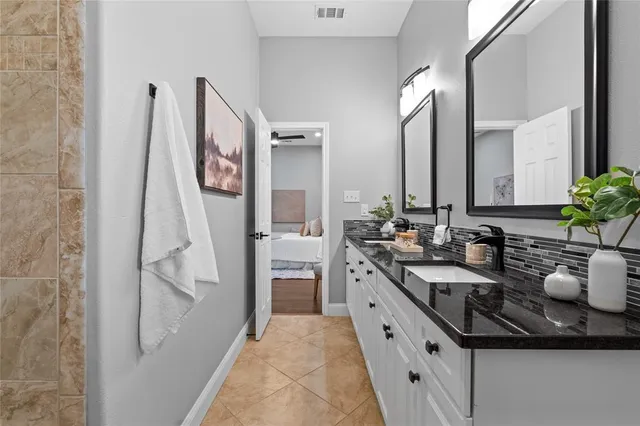 a kitchen with a sink and a refrigerator