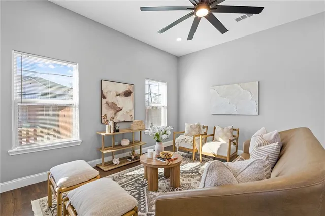 a living room with furniture and a window