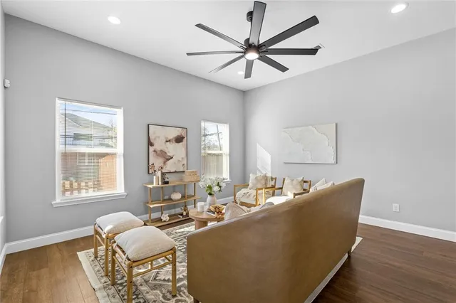 a living room with furniture a table and a window