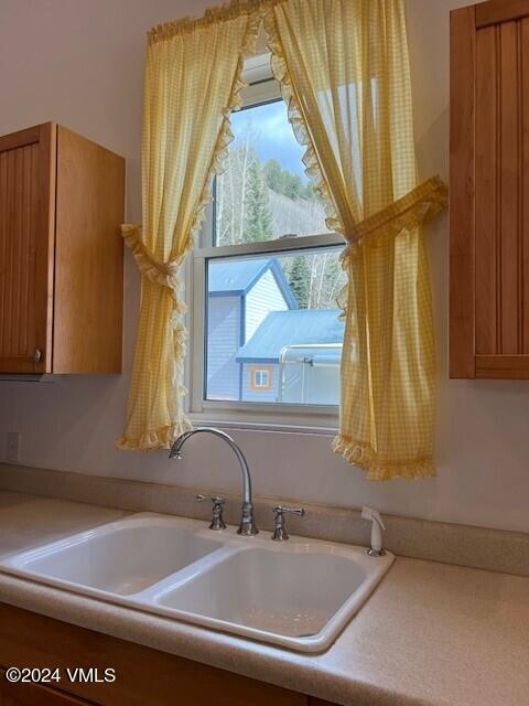 216 Eagle Street Red Cliff, CO 81649 - Photo 14 of 38 a bathroom with a sink and a mirror