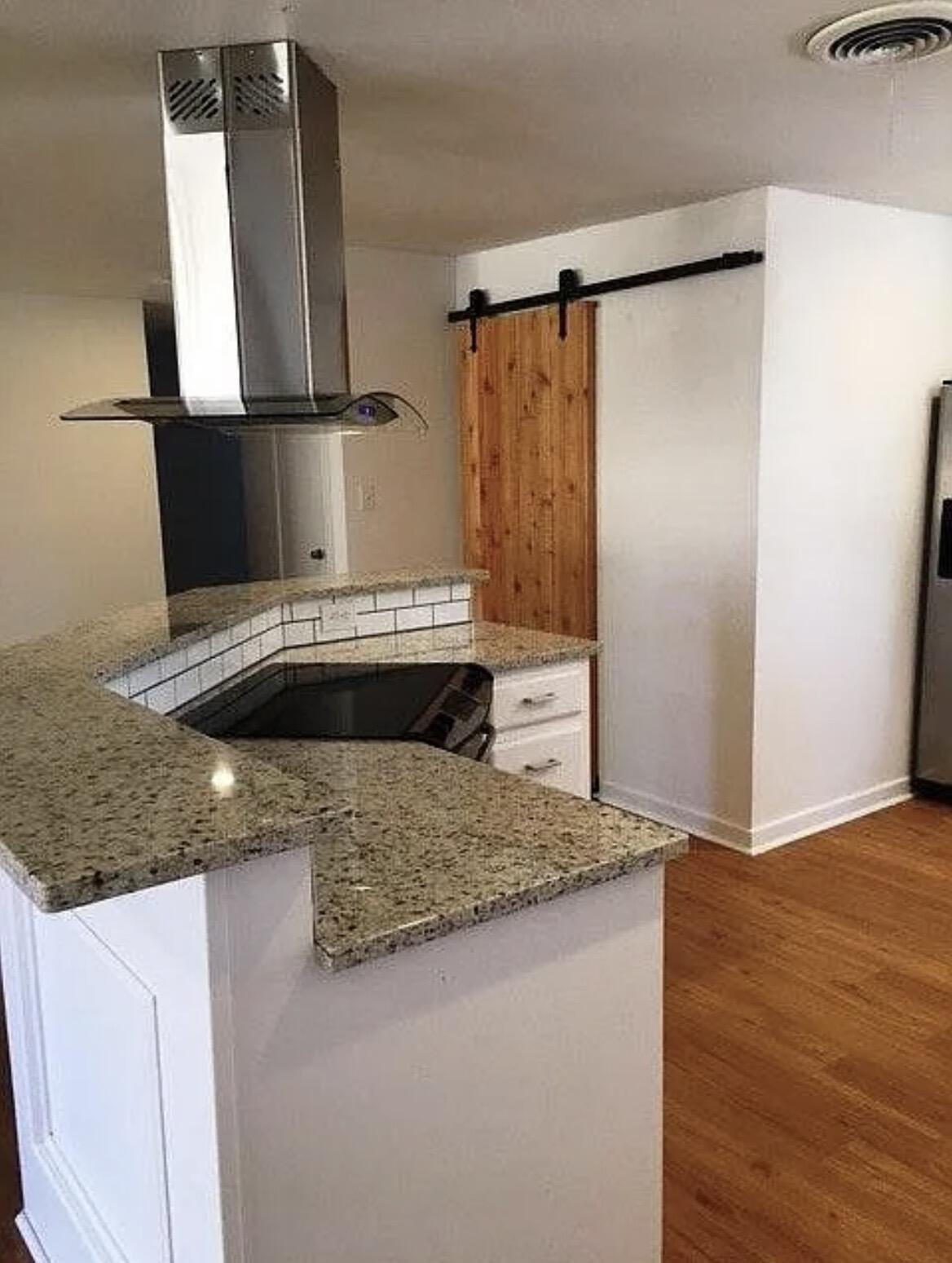 4914 17th Place Lubbock, TX 79416 - Photo 5 of 22 a bathroom with a granite countertop sink and a mirror