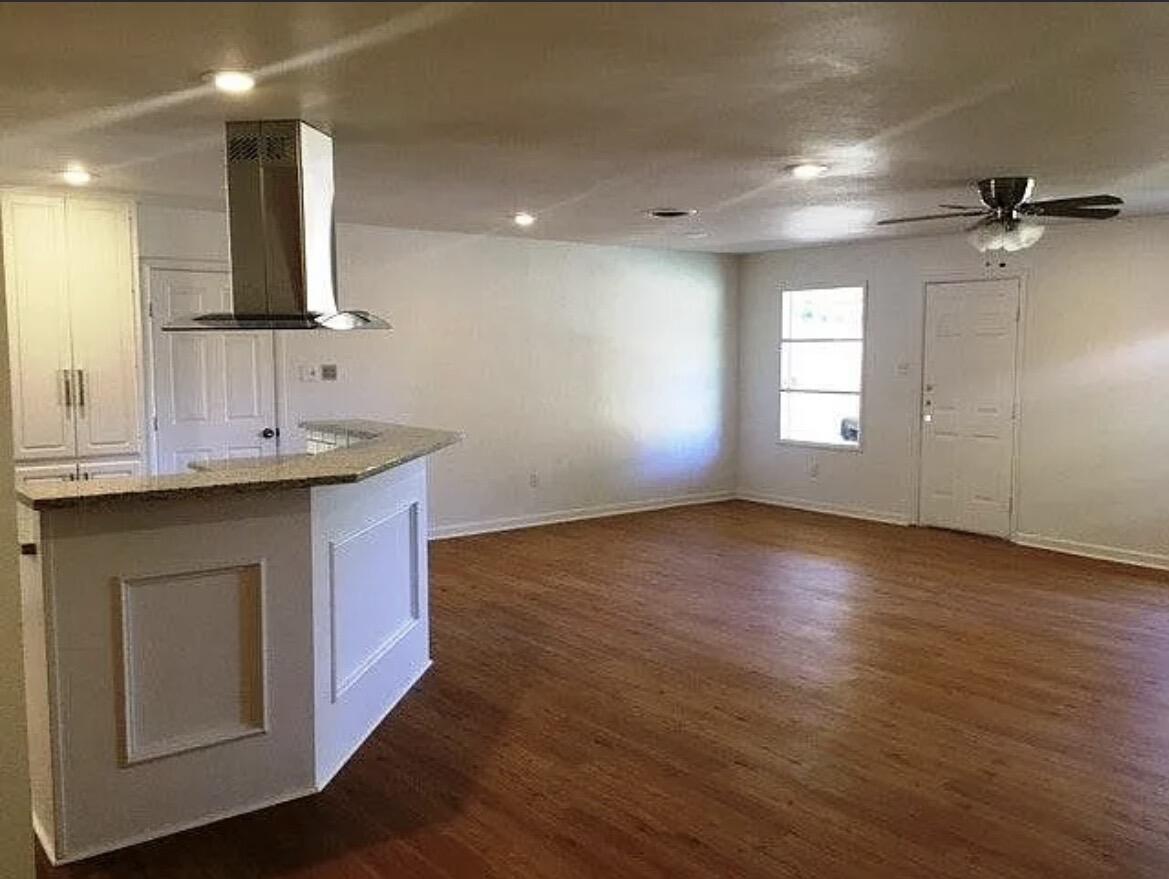 4914 17th Place Lubbock, TX 79416 - Photo 7 of 22 a view of a kitchen cabinets a sink and a window