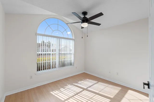 a view of an empty room with a window