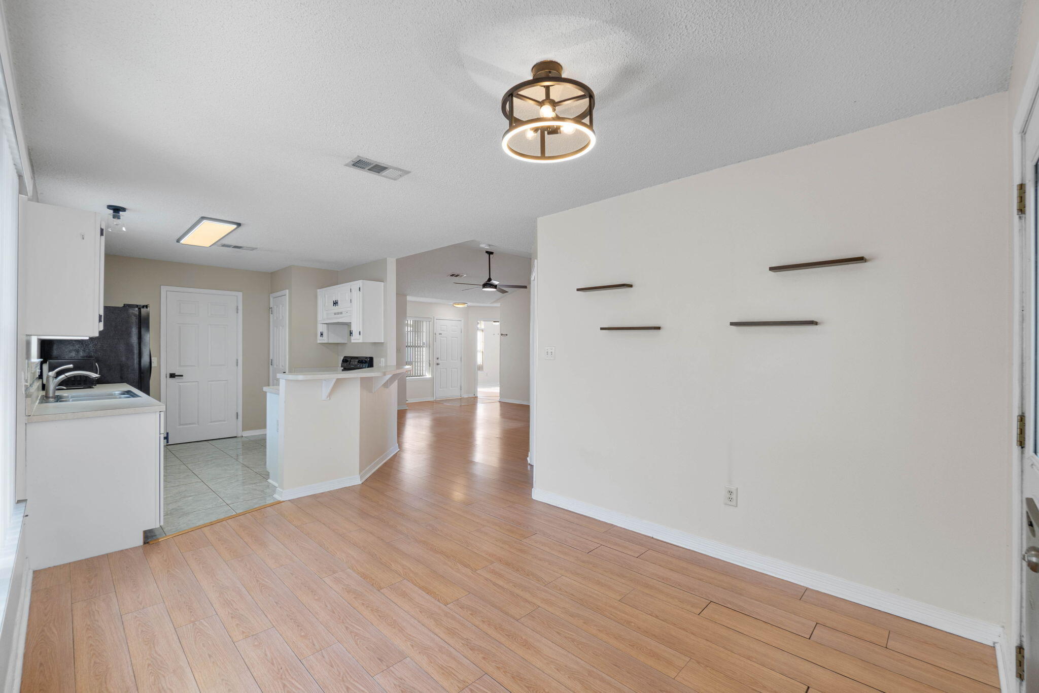 962 John Wayne Circle Fort Walton Beach, FL 32547 - Photo 9 of 25 a view of empty room with wooden floor